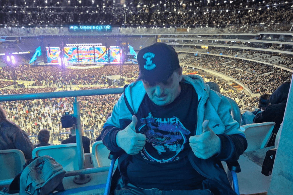 Image of Keith raising a thumbs up at the Metallica concert in Optus Stadium, organised by Mosaic's Community Access and Support team 